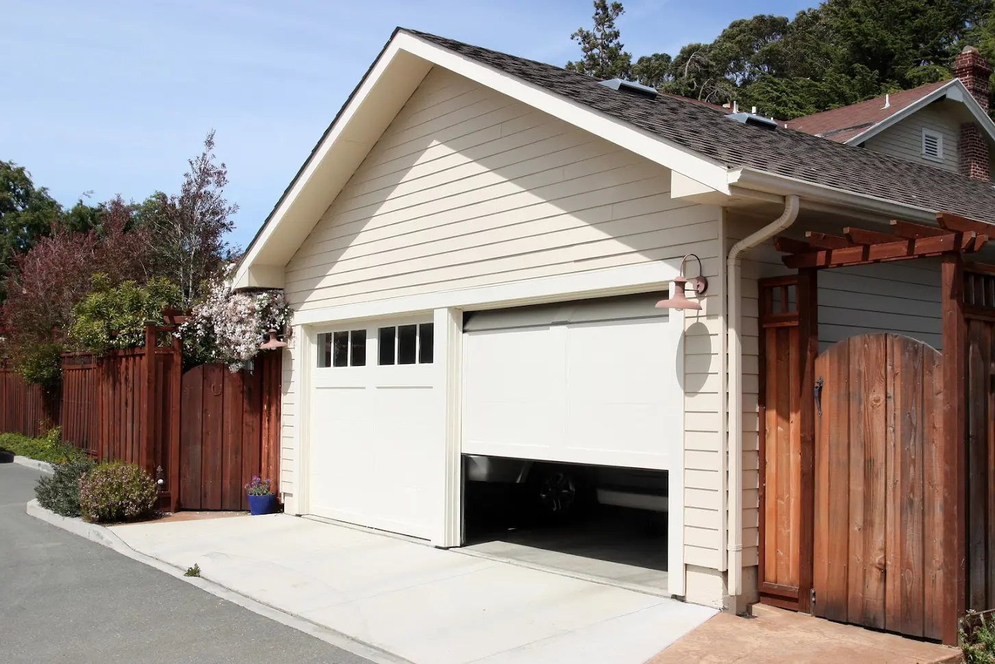 A garage door that is open and has no one inside.