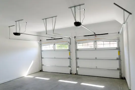 A garage with two doors and no windows.