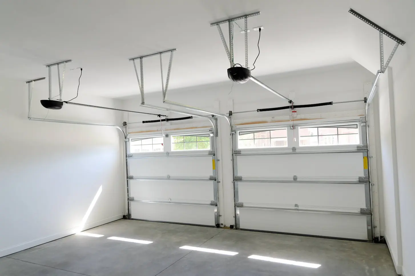 A garage with two doors and no windows.