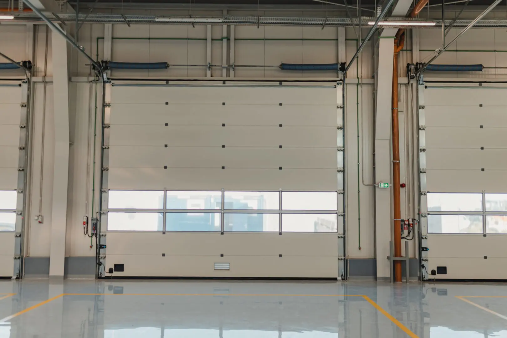 A large white garage door in an industrial building.