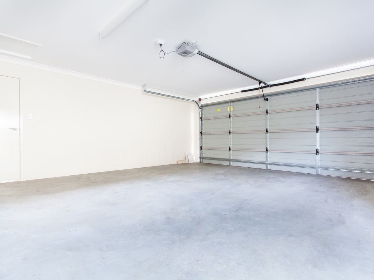 wide garage interior with concrete floor