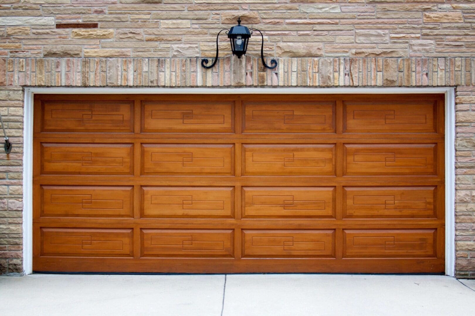 A garage door that is open and has a light on.
