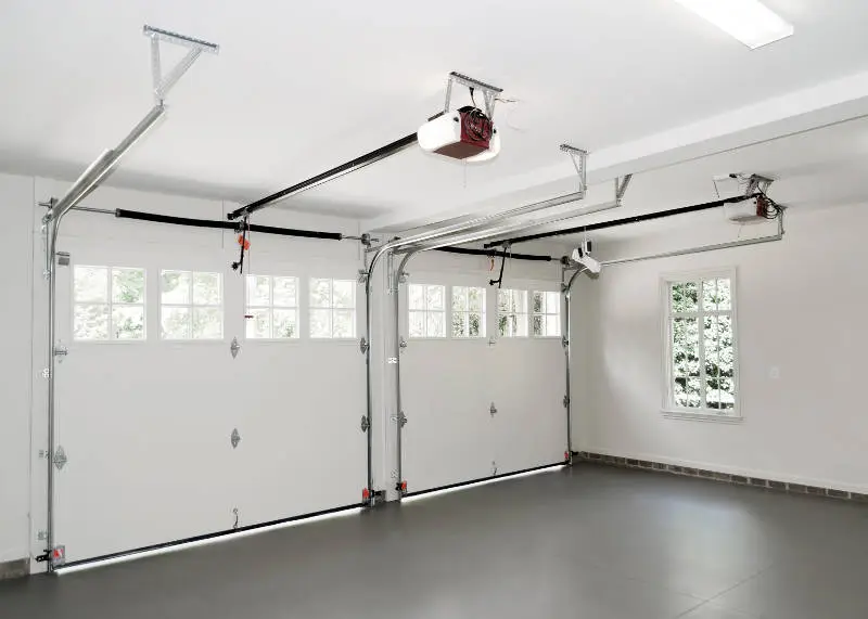 A garage with two doors and no windows.