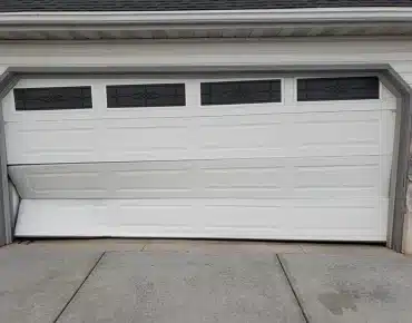 Broken residential garage door needing emergency repair in Ogden Utah