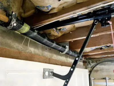 Garage door spring mechanism installation