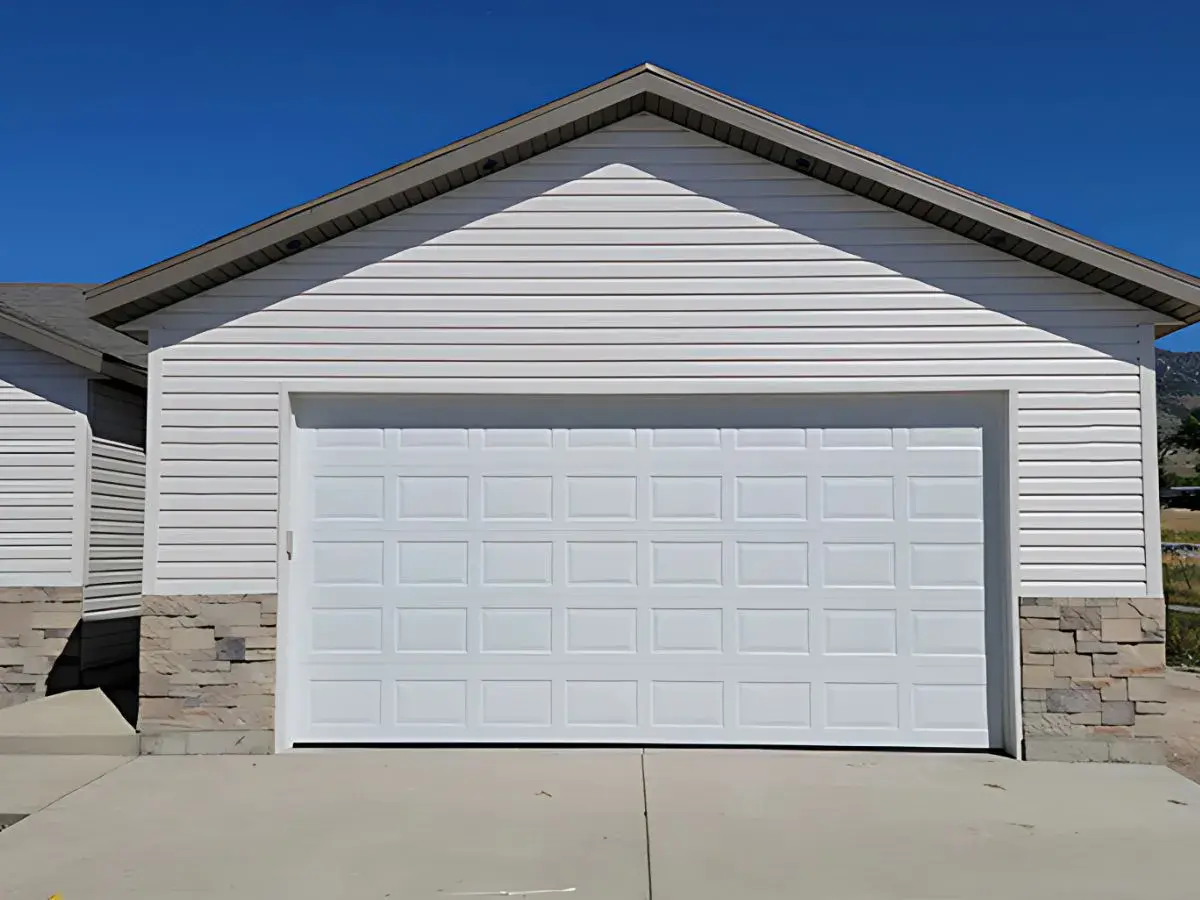 White garage door installation in Sunset, UT by Beacon Garage Doors | Expert repair & replacement